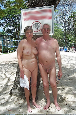 older couple love posing leafless