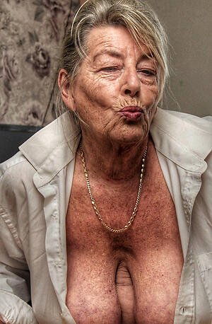 60 year ancient woman poses naked