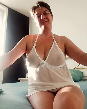 photoshooting with sexy Norwegian senior woman lingerie