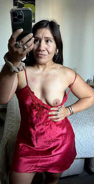 downcast latina granny poses unmask